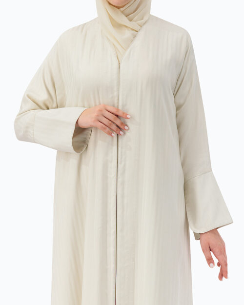 Model is wearing Off White Abaya w/Stripes Pattern- THE TWINS ABAYA