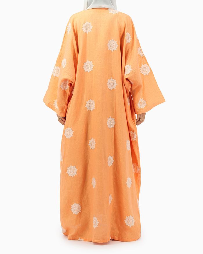 Model wears Orange Abaya