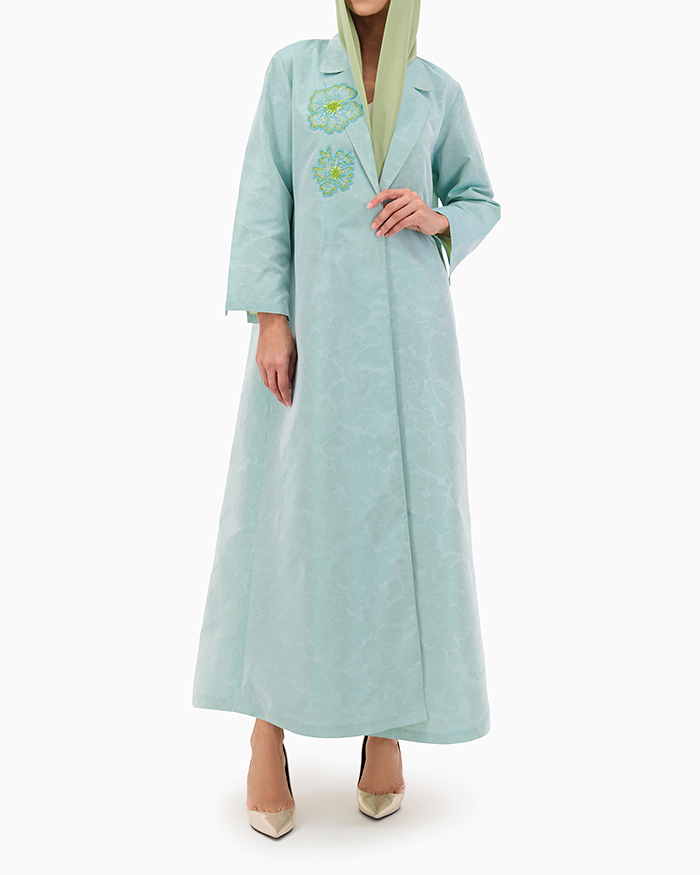 Model wears Mint Flower Abaya
