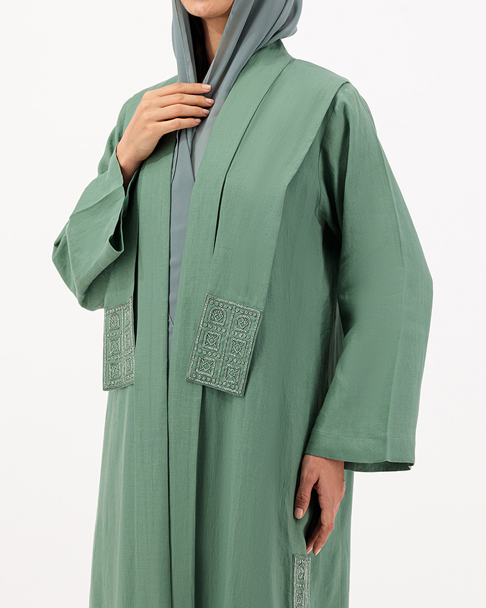 Model wears Green Linen Abaya