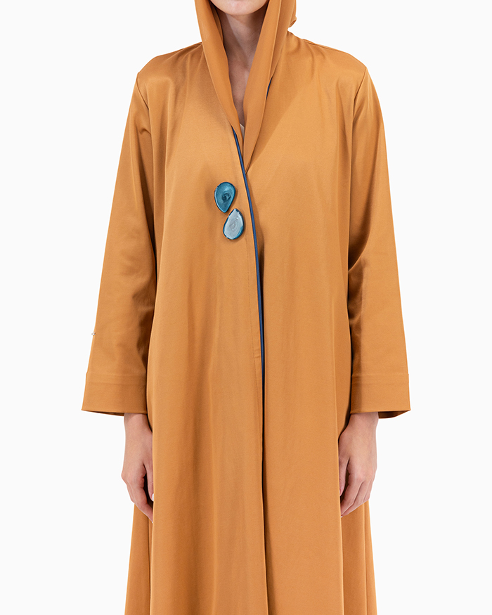 Model wears Gold Twilight Abaya With 2 Buttons