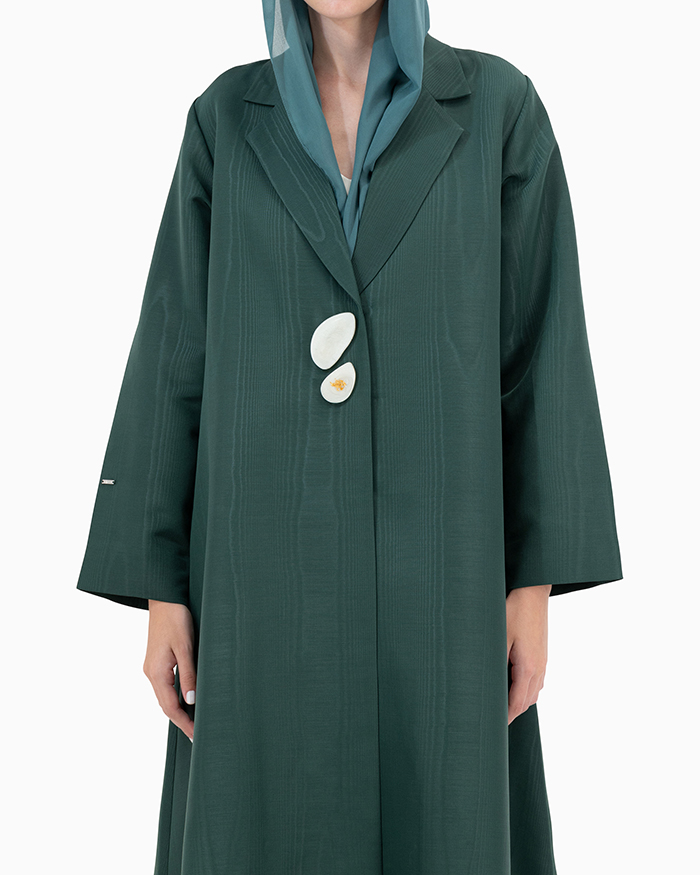 Model wears Dark Green Abaya With 2 Buttons